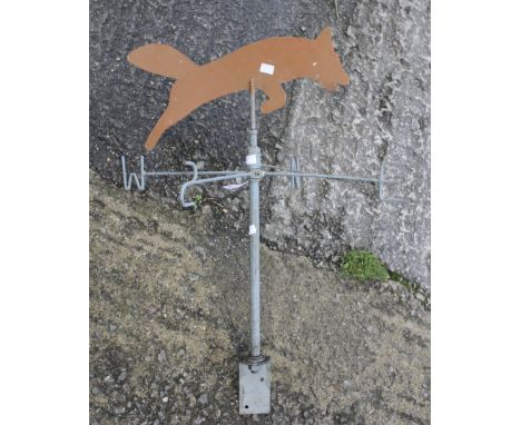 A contemporary cast metal weather vane. Modelled with a fox to the top, H76cm
