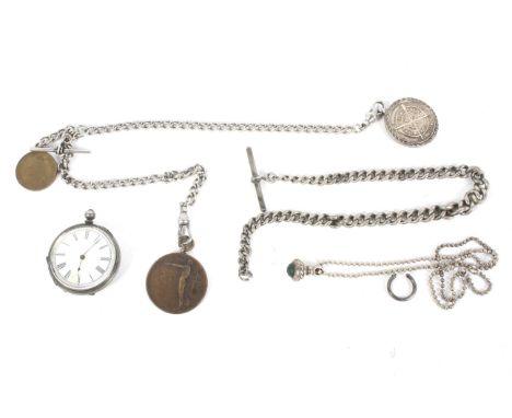 Silver fob watch, Albert chains and coins. The watch with a white enamel dial and Roman numerals, one of the chains set with 