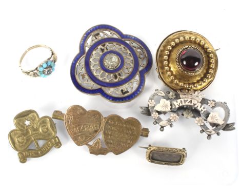 An assortment of costume jewellery and accessories. Including brooches, an enamel belt buckle and turquoise set ring