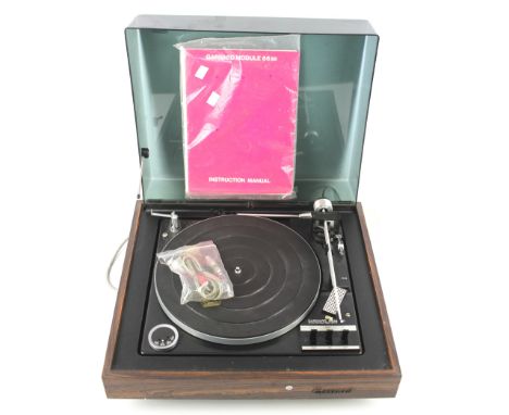 A Garrard 86 SB record turntable, with a faux rosewood finish. Electrified, with manual, 46cm x 40.5cm 