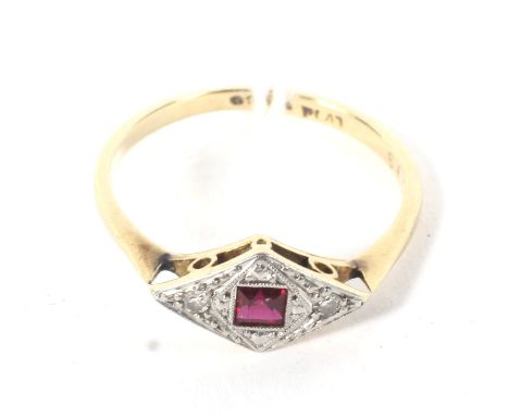 A 9ct yellow gold and platinum Art Deco ring. Set with a square cut ruby and four diamonds, weight 2.2g, size O/P