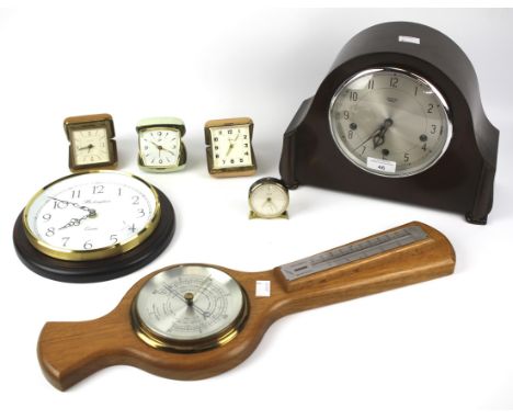 An assortment of clocks, barometers and travel clocks. To include a wooden cased Smiths mantel clock, Tempora travelling cloc