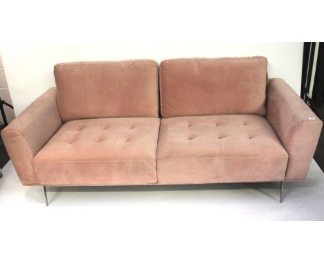 A contemporary sofa. Upholstered in pink suede, raised on chrome tapered supports, L210cm x D92cm x H90cm (including cushions