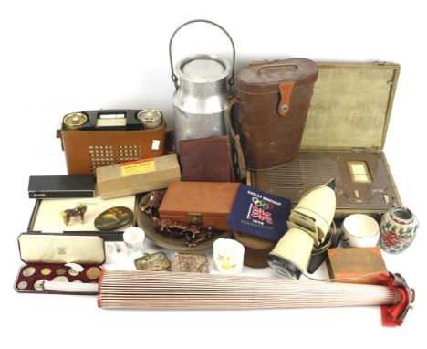 An assortment of collectables. Including: a 1953 Coronation cased set of coins, a mid-century Gnome enamelled lamp, a cased M