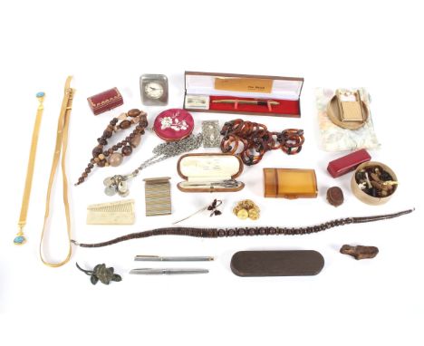 An assortment of costume jewellery. Including necklaces, buttons, two red boxes marked 'Cartier', etc