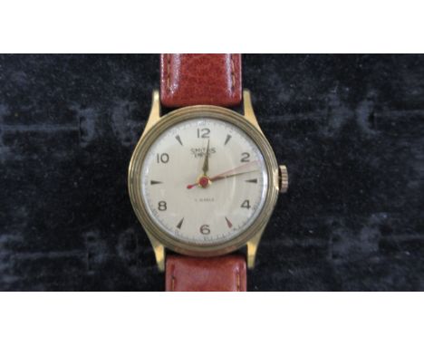 A Smiths Empire manual wind Gents watch on a leather strap, working in saleroom 