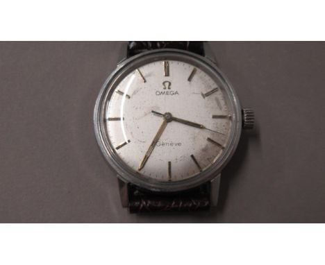 A gents Omega Geneve Seamaster stainless steel case, manual wind wristwatch - case 34mm - working in the saleroom 