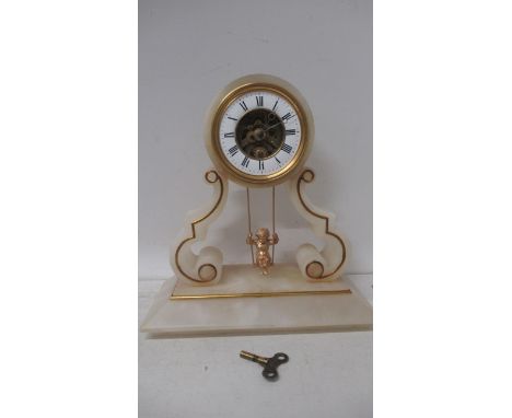 A 19th century French alabaster swinging cherub mantel clock, 30cm high x 13cm wide, recently serviced 