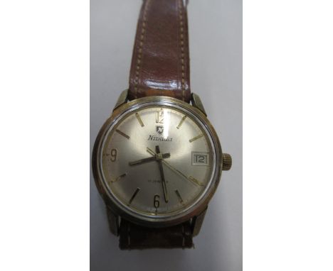 A gents Nivada manual watch with date and seconds on brown leather strap - working in the saleroom - case size 32mm