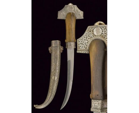 dating: circa 1900 provenance: Morocco, Curved, single-and false-edged blade with tang; horn grip with silver mounts, richly 