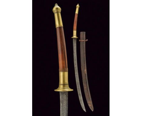 dating: Late 19th Century provenance: Thailand, Curved, single-edged blade; wooden grip with brass mounts, engraved with ring