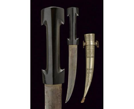 dating: 19th Century provenance: North Africa, Curved, double-edged blade, in damask. Ebony grip with double 'T' (hole in the