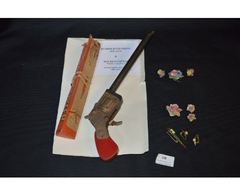 Rocket Copter Toys,Rubber Band Gun and Ceramic Flower Brooches 