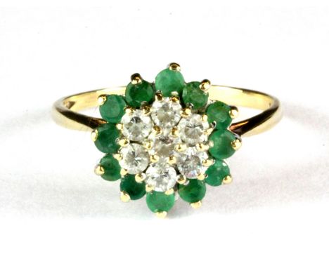 A 9ct yellow gold emerald and cubic zirconia set cluster ring, (P.5).