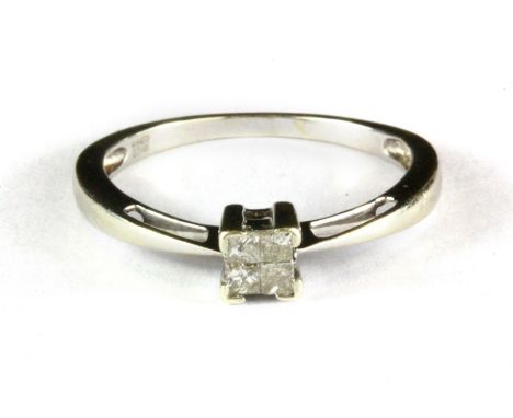 A 9ct white gold four princess cut diamond set ring, (P).