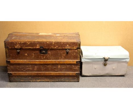 A large wooden cabin trunk and contents. W. 85 H. 55cm. Together with a metal cabin trunk.