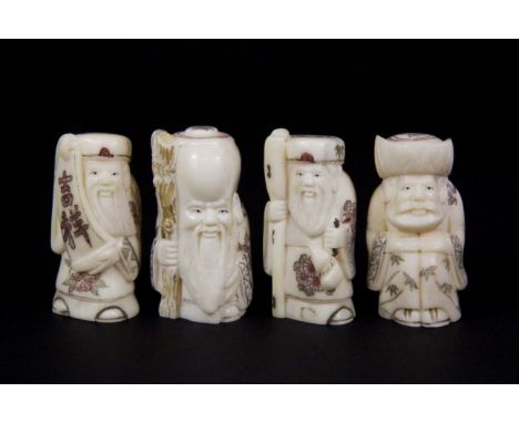 A group of four carved bone netsuke, H. 5cm.