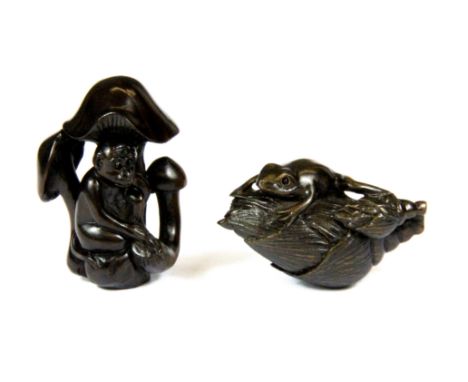 Two carved dark fruitwood netsuke both with polished onyx eyes, monkey H. 5.5cm.