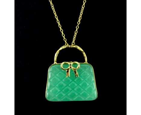 A 925 silver gilt hand bag shaped pendant set with carved and polished jadeite jade in a 925 silver gilt chain, pendant 2.8 x