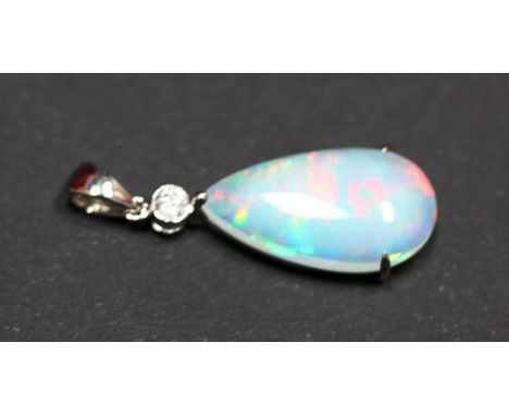 A 14ct white gold (stamped 585) pendant set with a 4.99ct pear shaped cabochon cut opal and an 0.10ct brilliant cut diamond, 