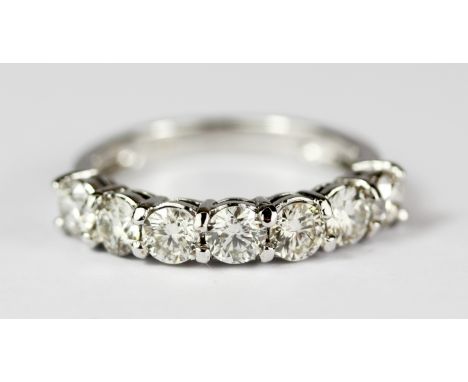 An 18ct white gold (stamped 750) ring set with seven brilliant cut diamonds, approx. 1.42ct overall, colour H-I, clarity SI, 
