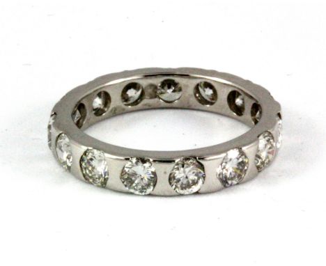 A white metal (tested 18ct gold) full eternity ring set with brilliant cut diamonds, approx. 3ct overall, (N.5).
