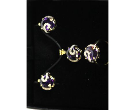 A boxed 9ct yellow gold (stamped 375) jewellery suite consisting of pendant, ring and pair of earrings, set with amethyst and