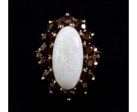 A 9ct yellow gold opal and garnet set large cluster ring, L. 2cm, (L).