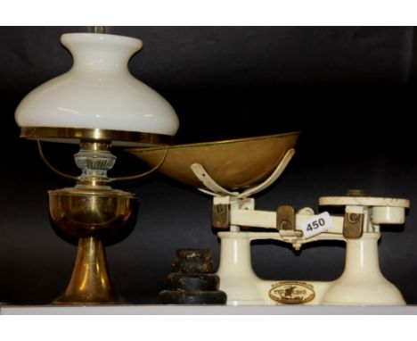 An oil lamp and kitchen scale.