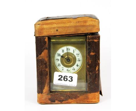 A gilt brass carriage clock, H. 14cm, together with a carrying case.
