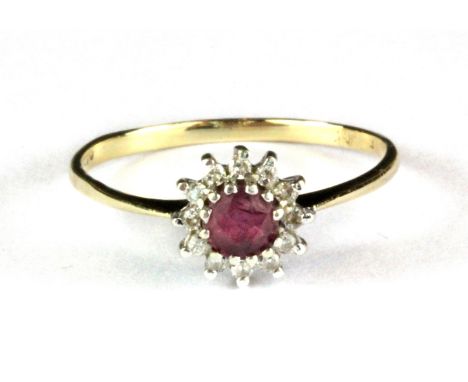 A 9ct yellow gold ruby and diamond set cluster ring, (P.5) (chip to the ruby).