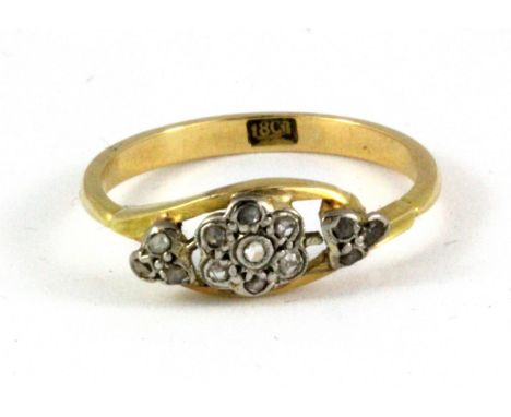 An antique 18ct yellow gold cluster ring set with three faceted rose cut diamonds, (L.5).