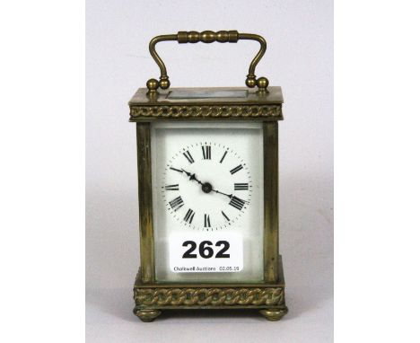 A gilt brass carriage clock, H. 14cm.