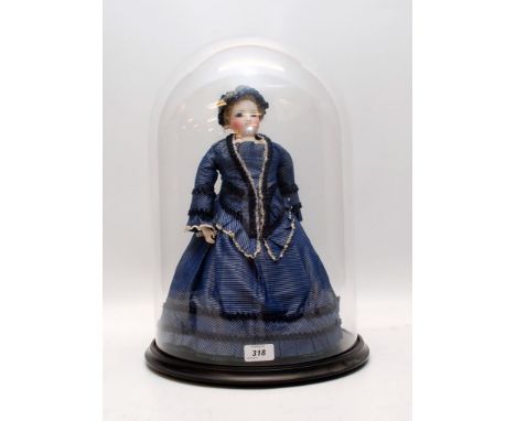 A STEINER BISQUE AUTOMATON DOLL UNDER GLASS DOME WITH WHEELS TO BASE, HEIGHT 42CM (LATER DRESS)