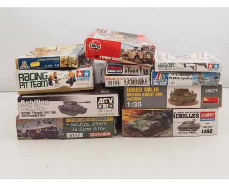 A group of unbuilt plastic military vehicle and figure kits in various scales by ITALERI, TAMIYA and PREISER  and others - un
