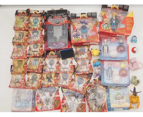 A large quantity of carded and uncarded figures from the YU-GI-OH! And POKEMON ranges by MATTEL and others - G/VG in F/G pack