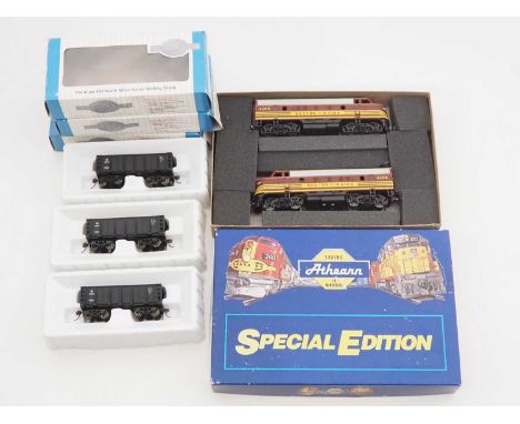 A group of HO gauge American Outline rolling stock comprising: an ATHEARN Class F7A diesel locomotive pair in Boston & Maine 