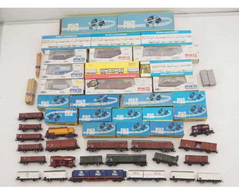 A large quantity of boxed and unboxed HO gauge model railway wagons by PIKO and others - G in F/G boxes (46 - 24 boxed togeth