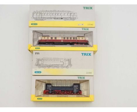A pair of TRIX HO gauge German Outline model railway items comprising a V120 diesel loco and a VT859 passenger rail car - VG 