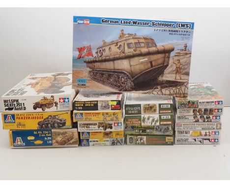 A group of unbuilt plastic military vehicle and figure kits in various scales by TAMIYA, DRAGON, ITALERI and others - uncheck