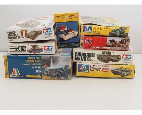 A group of unbuilt plastic military vehicle kits in various scales by TAMIYA, ITALERI and others - unchecked but appear compl