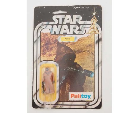 A PALITOY Star Wars Jawa figure with rare Vinyl Cape on original 12-back card (SW-12B) from the first year of production in 1
