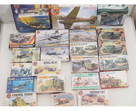 A group of unbuilt plastic military vehicle kits in various scales by AIRFIX, MATCHBOX and others - all appear complete and u