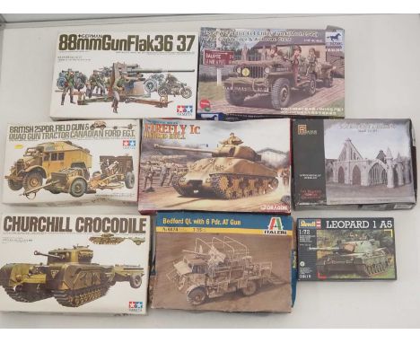 A group of unbuilt plastic military vehicle kits in various scales by TAMIYA, ITALERI and others - unchecked but appear compl