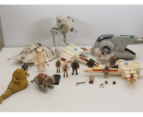 A quantity of vintage 1970s/early 80s KENNER/PALITOY STAR WARS vehicles, to include Jabba The Hutt and various other associat