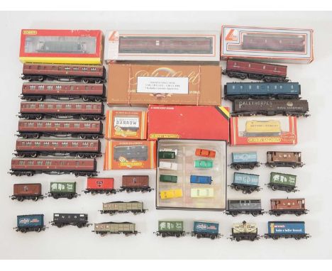 A large quantity of mostly unboxed OO gauge rolling stock by HORNBY, LIMA and others together with a group of unboxed TRIANG 