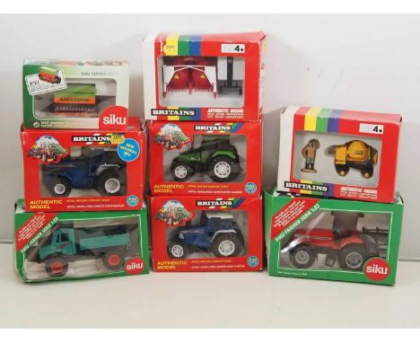 A group of 1:32 scale diecast tractors and agricultural vehicles by BRITAINS and SIKU - G/VG in F/G boxes (8)