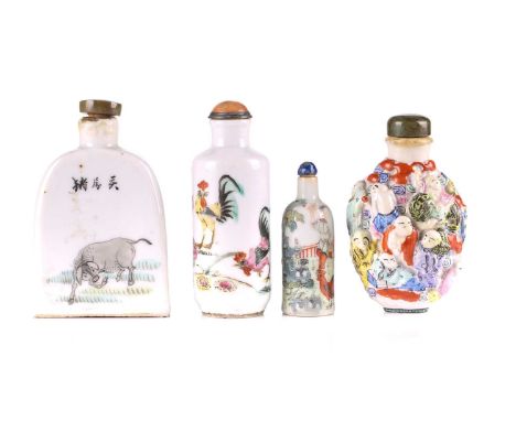 Four Chinese porcelain snuff bottles, 20th century, one moulded with numerous boys and men amongst clouds and a puppet shishi