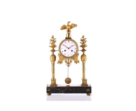 A Lefevre sue de Belle á Paris Empire style portico gilt metal mantle clock, with white enamel dial, Roman numerals, on a rec