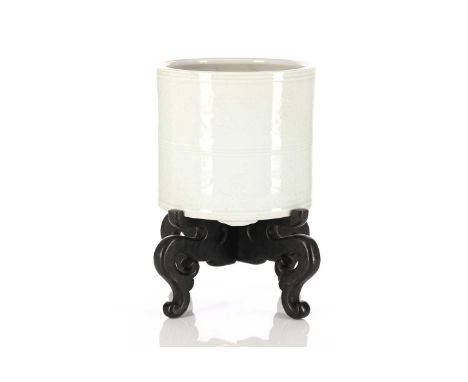 A Chinese porcelain anhua bitong, of cylindrical form, anhua decorated with dragons chasing flaming pearls between moulded ba